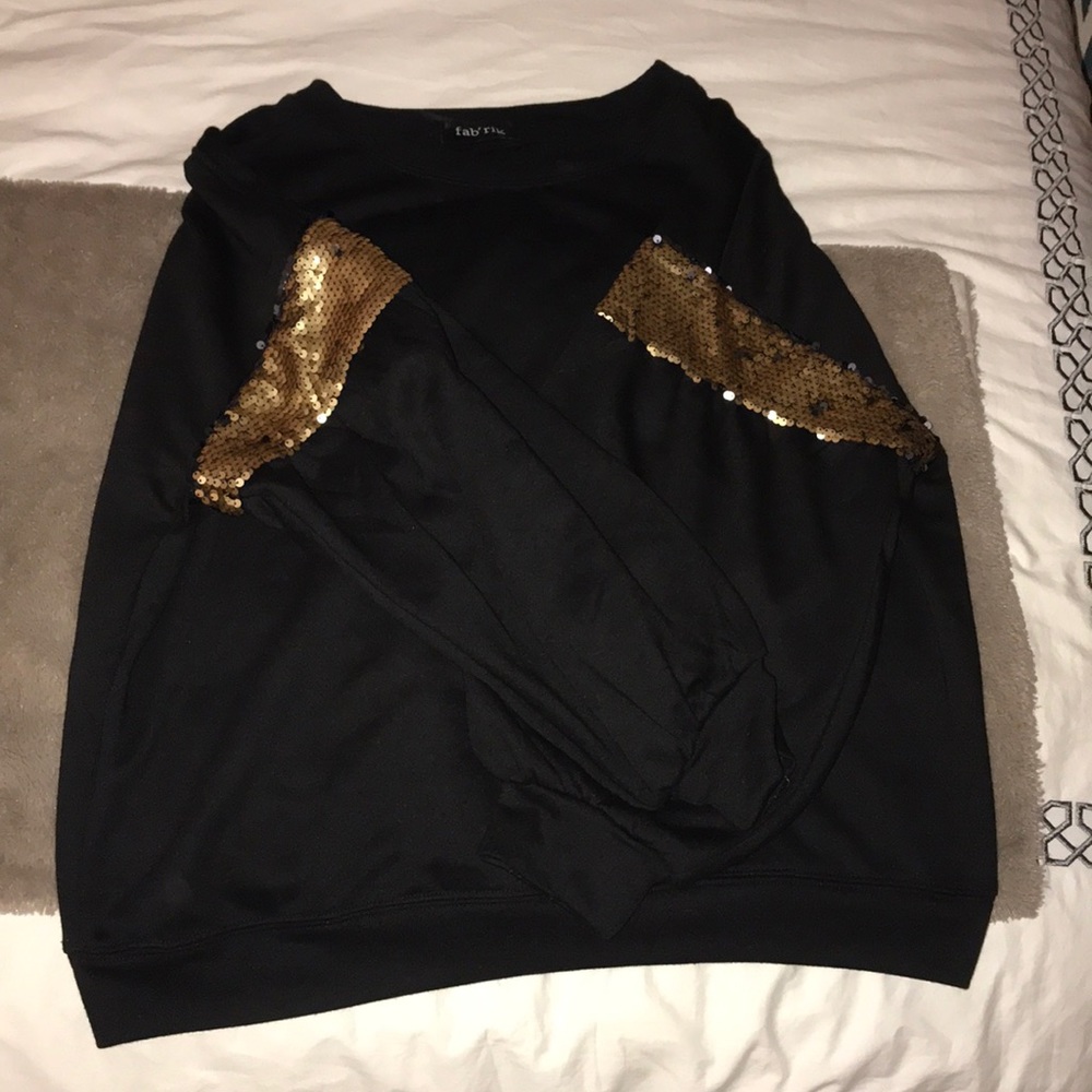 Black sweater with gold accent sleeves